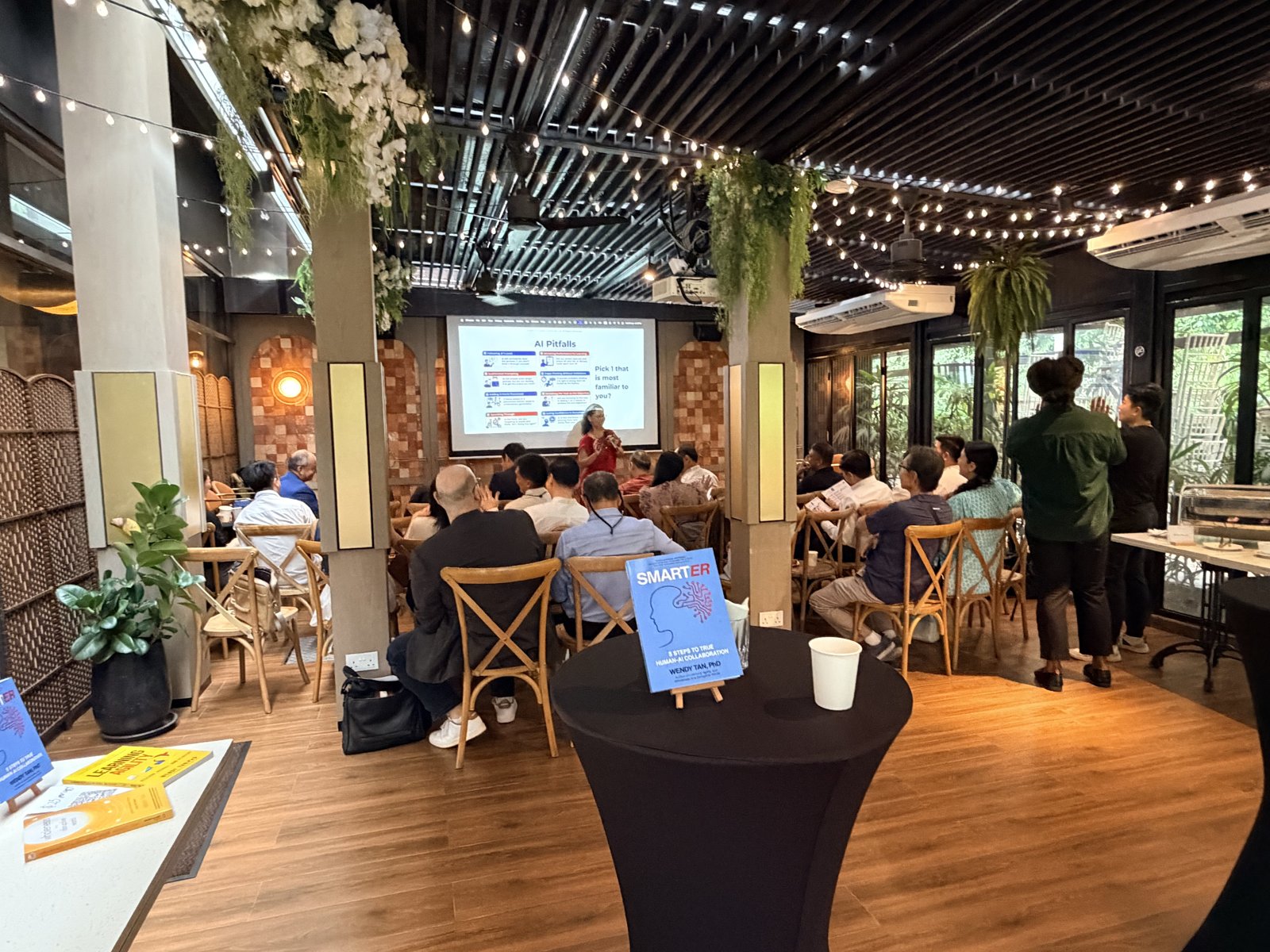 The SMARTER book launch and panel in Singapore, June 2026 — a full room with the book on display
